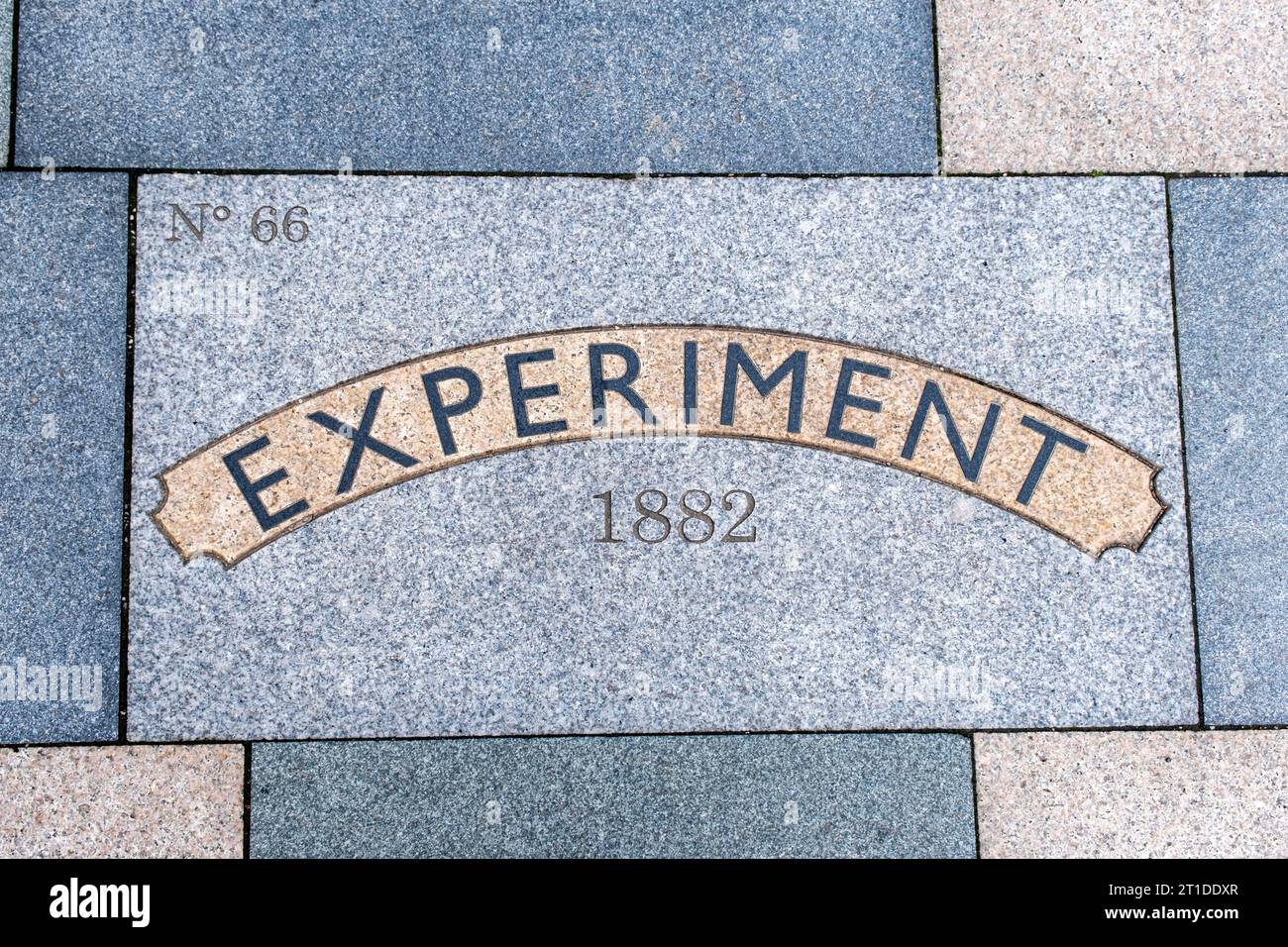 Paving slab in West Street Crewe saying Experiment, train build at Crewe Works No 66 in 1882 Stock Photo