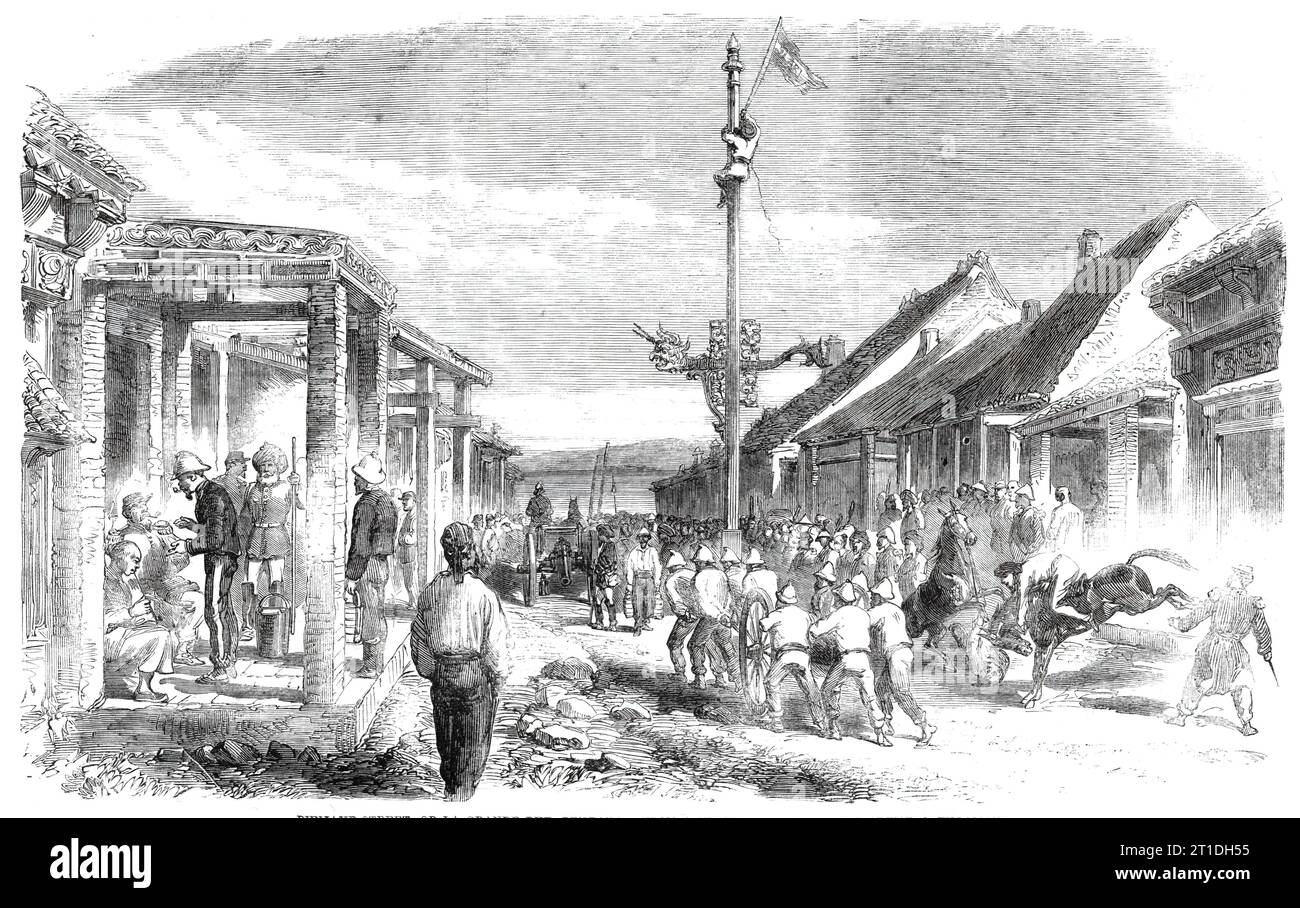 The War in China - Punjaub-street, or La Grande Rue, Pehtang - from a sketch by our special artist, C. Wirgman, 1860. European and Indian soldiers. 'The right side of the road is occupied by the 15th Punjaub Infantry (Pioneers), and the opposite side by the French troops. The whole day long this street is filled with troops of all nations; with the trim, neat, English-looking soldier, and his looser and more swaggering ally, the khaki dress and dark chocolate turban of the Sikh, contrasting well with the gayer and picturesque dress of our irregular cavalry...Working parties from the Sikhs are Stock Photo