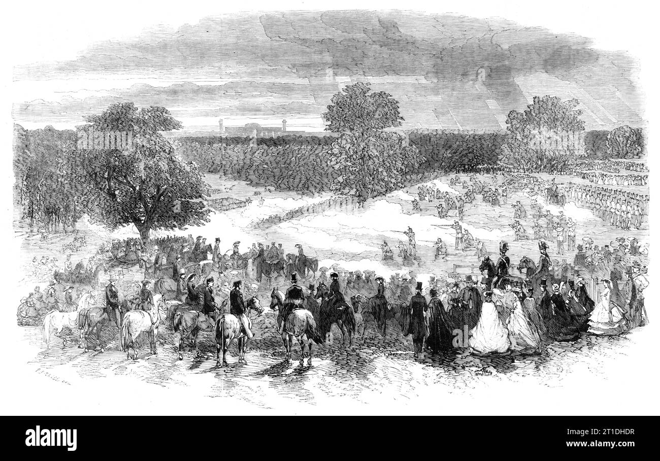The Volunteer Sham Fight in Camden Park - skirmishers covering the retreat, 1860. Fake battle by British soldiers in Kent. '...the appointed scene of operations [was] a valley, one slope of which was fringed by Bickley Wood, and the other bounded by one of the little Kentish hills...a stream running through at the bottom...completed a miniature field with all the necessary strategical positions. Over the stream was constructed a temporary bridge, which, at the proper stage of the proceedings, blew up with a loud report, the explosion sending planks into the air in all directions, to the immine Stock Photo