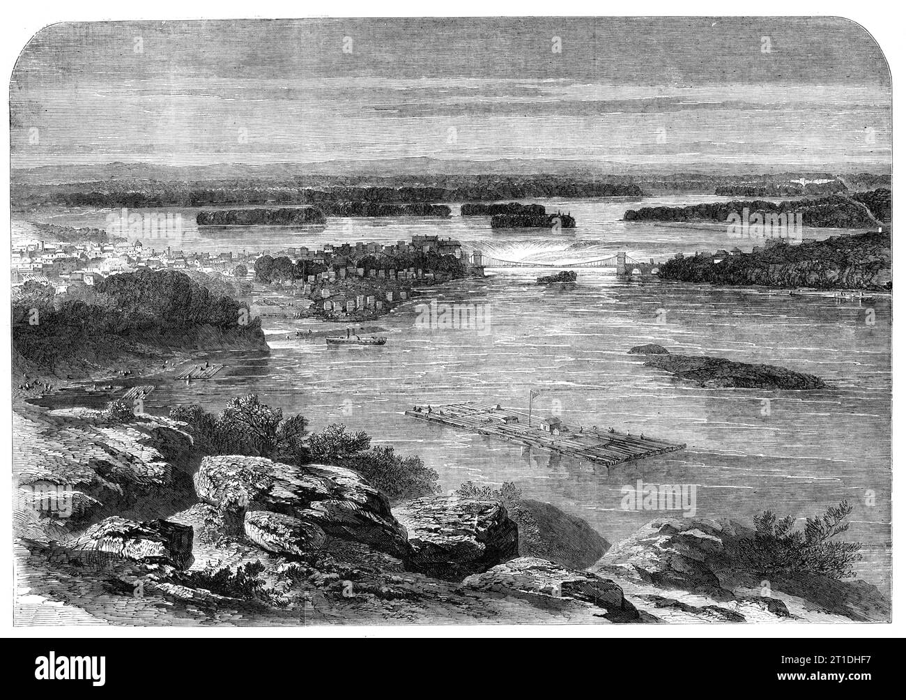 Progress of the Prince of Wales in Canada - view of part of the city and river of Ottowa, from the Barrack Hill, the site of the new Parliament Buildings - from a sketch by our special artist, G. H. Andrews, 1860. 'Taking a bird's-eye view of the valley of the Ottawa, we see spread out before us a country equal to ten times the extent of Massachusetts, with its great artery the Ottawa curving through it...At the western extremity of the city are the celebrated Chaudiere Falls, a scene of imposing grandeur...A suspension-bridge...spans this foaming chasm, and unites Upper with Lower Canada...th Stock Photo