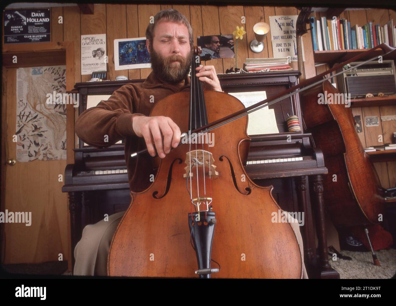 A 1983 portrait of English jazz double bassist, composer & bandleader Dave Holland in his home studio in upstate New York. Stock Photo