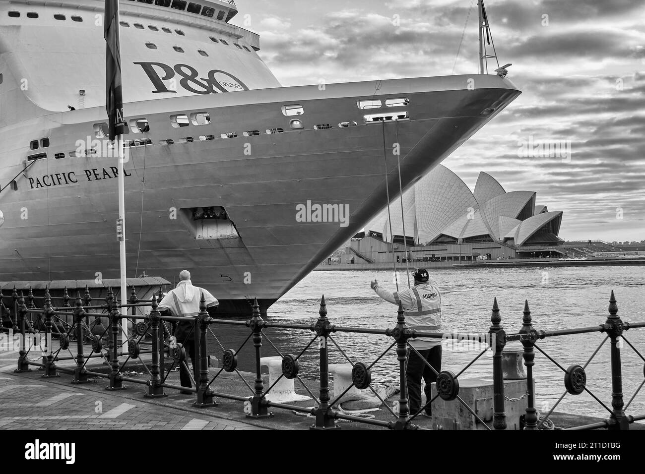 Black And White Photo Of The P&O Cruises Australia, Cruise Ship, MV PACIFIC PEARL Docks  In Circular Quay, Sidney After Sunrise. Stock Photo