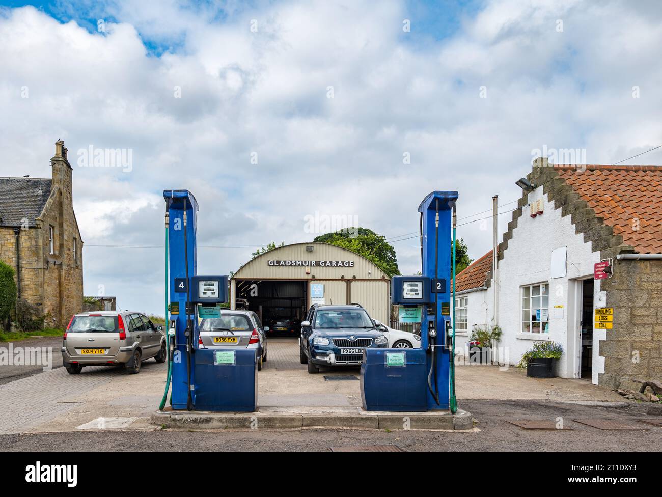 Old fashioned garage and petrol pumps, Gladsmuir, East Lothian, Scotland, UK Stock Photo