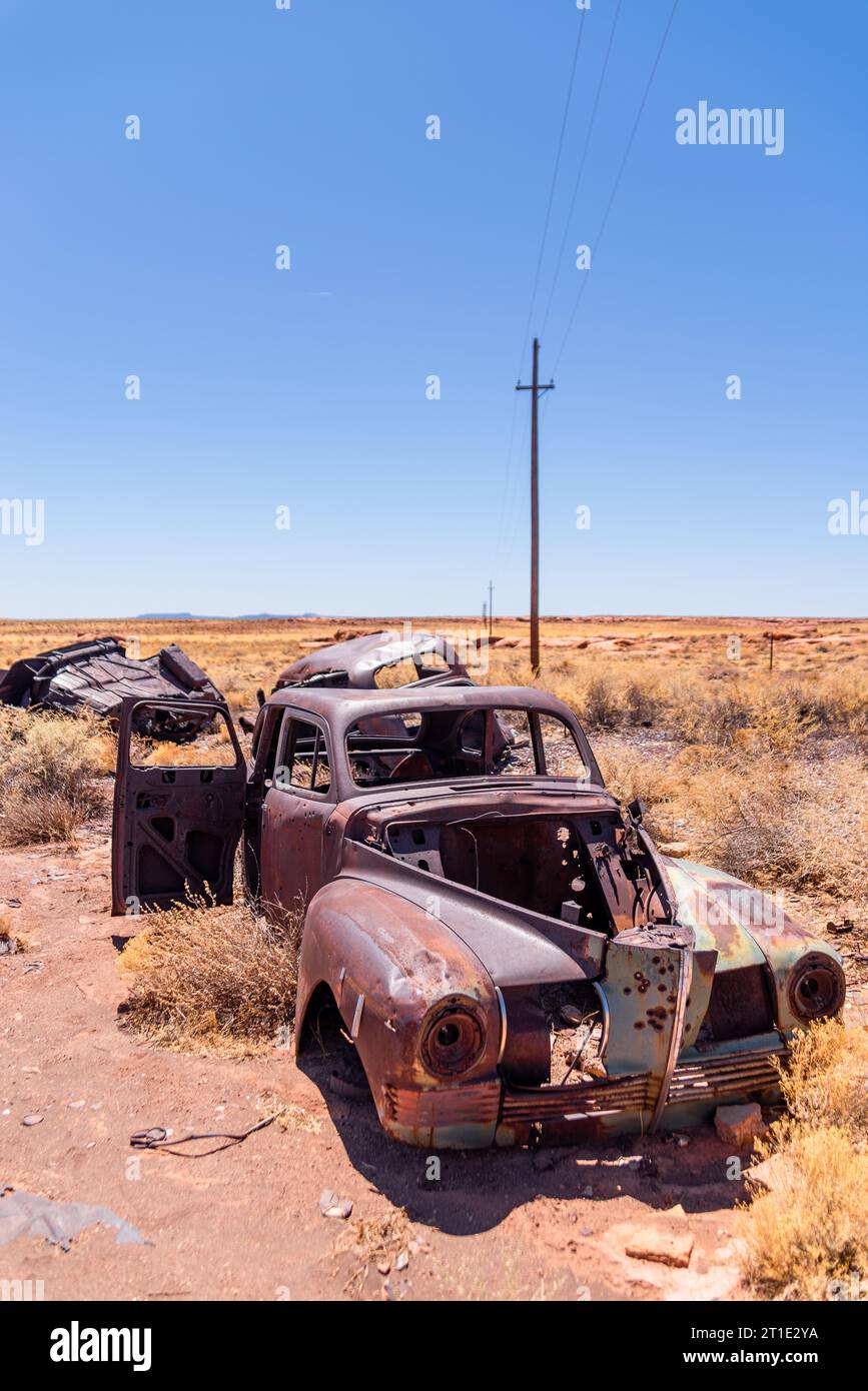 Rusted old car with bulletholes in the Arizona desert. Stock Photo