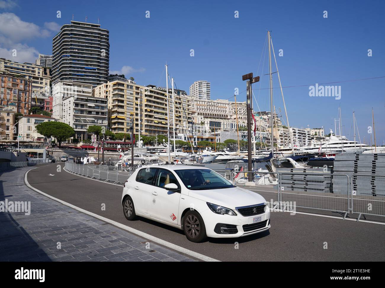 Traffic goes round the harbour on the Monaco Grand Prix circuit in it's non race configuration. Stock Photo