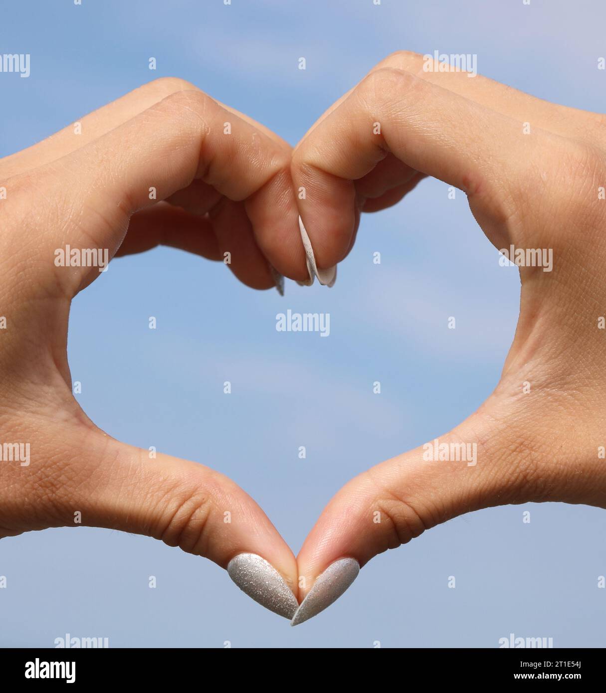 Two Joined Hands Forming The Shape Of A Heart And The Background Of The 