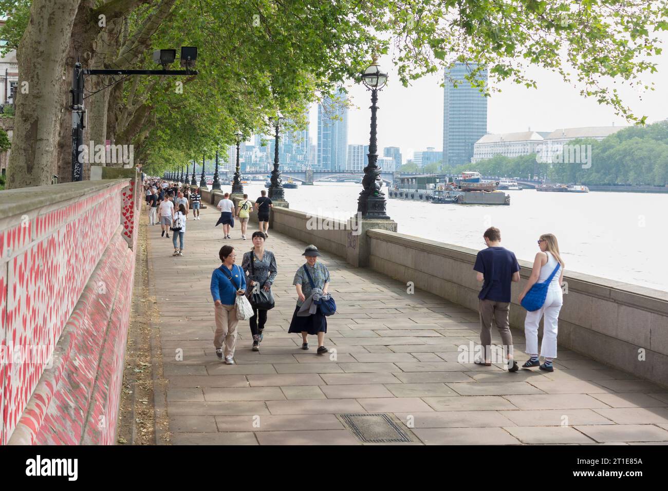 People walking on the Albert Embankment path, London, England Stock Photo