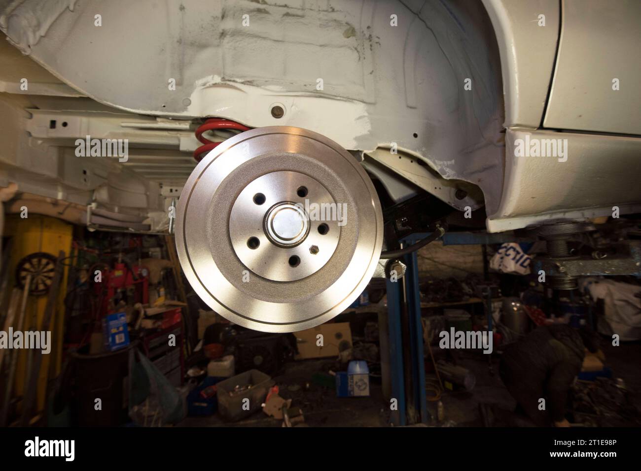 a motor mechanic works on the brake - A Motor Mechanic Works On The Brake Of A Car Brake Repair Of A Car 2T1E98P