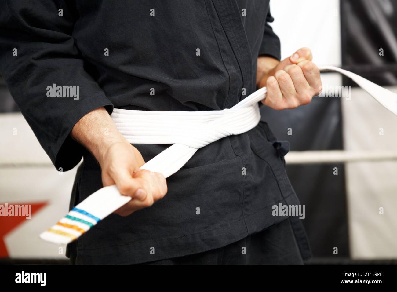 Man, hands and white belt in karate of martial arts beginner, training