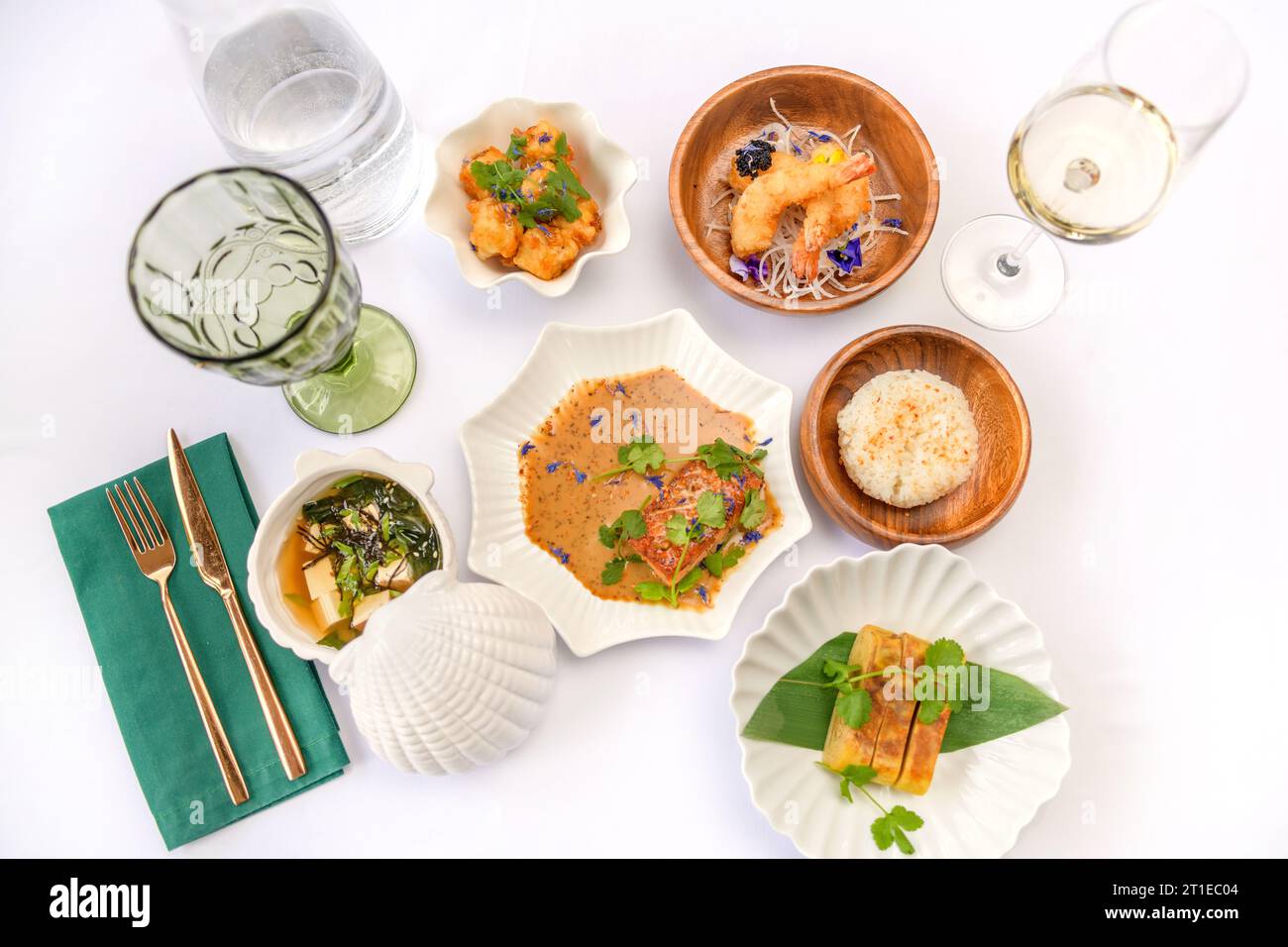 Set of Japanese dishes: miso soup, tamago, tempura shrimp, rice isolated Stock Photo