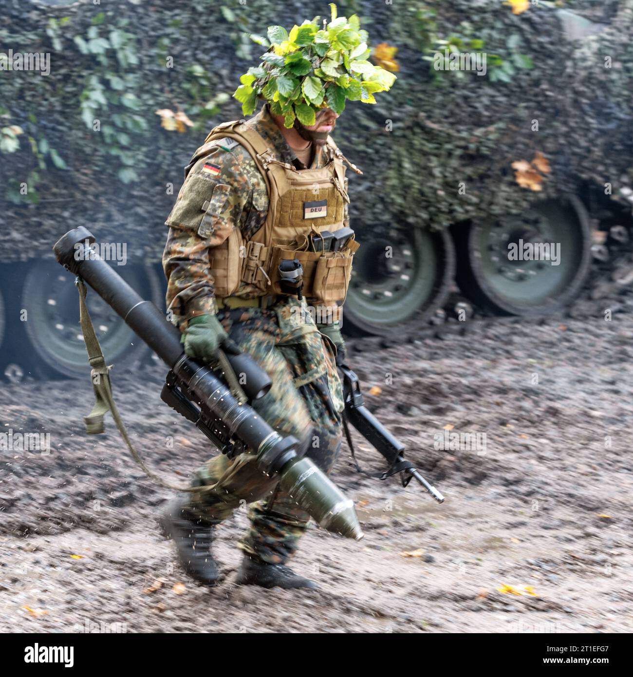Hagenow, Germany. 13th Oct, 2023. An armored infantryman walks past an