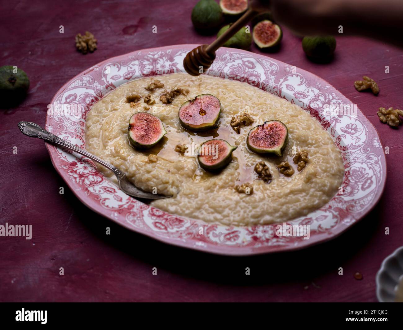 Porridge with roasted figs, walnuts, and honey Stock Photo