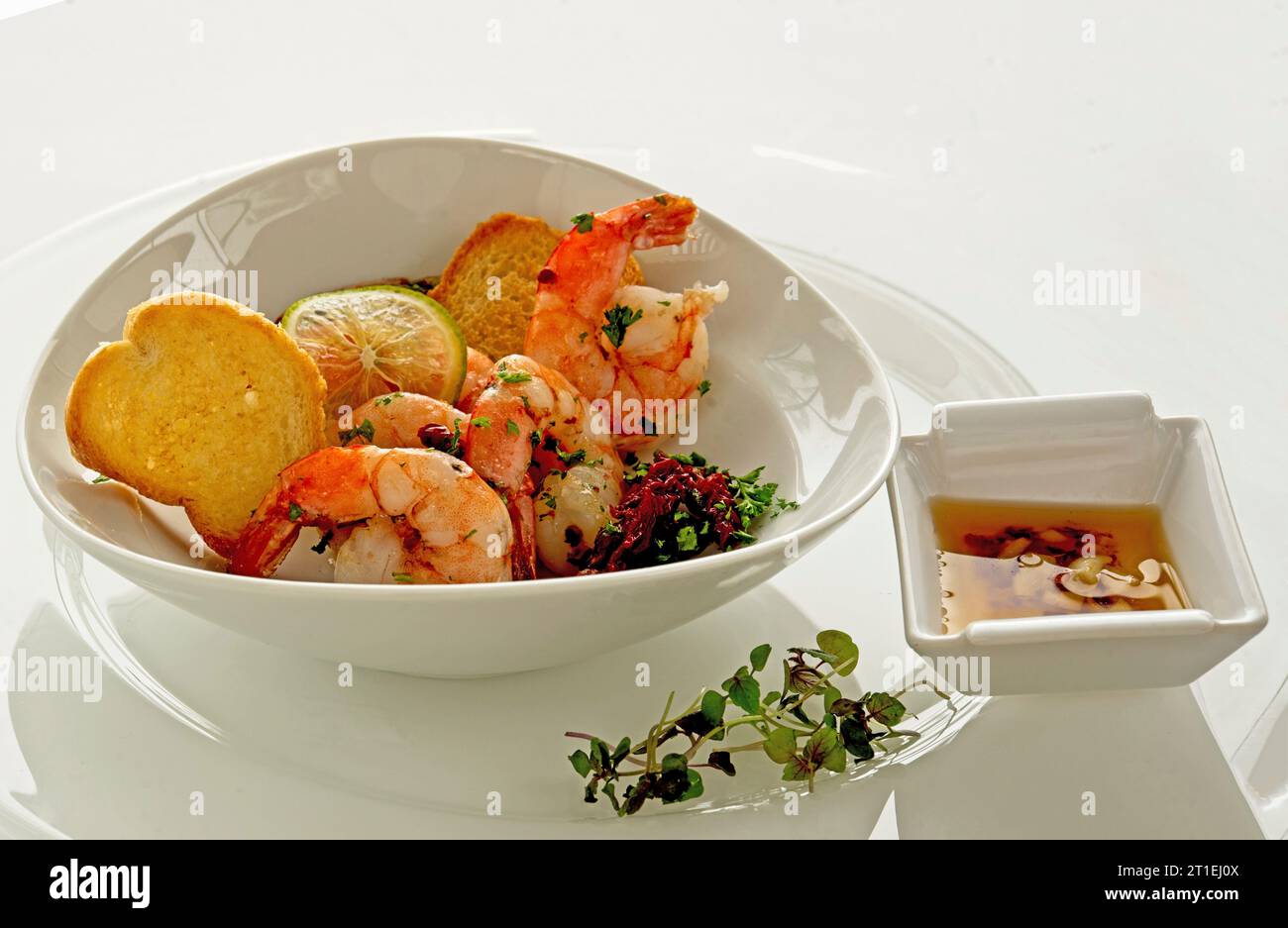Shrimp salad with baguette, micro greens and garlic dip Stock Photo