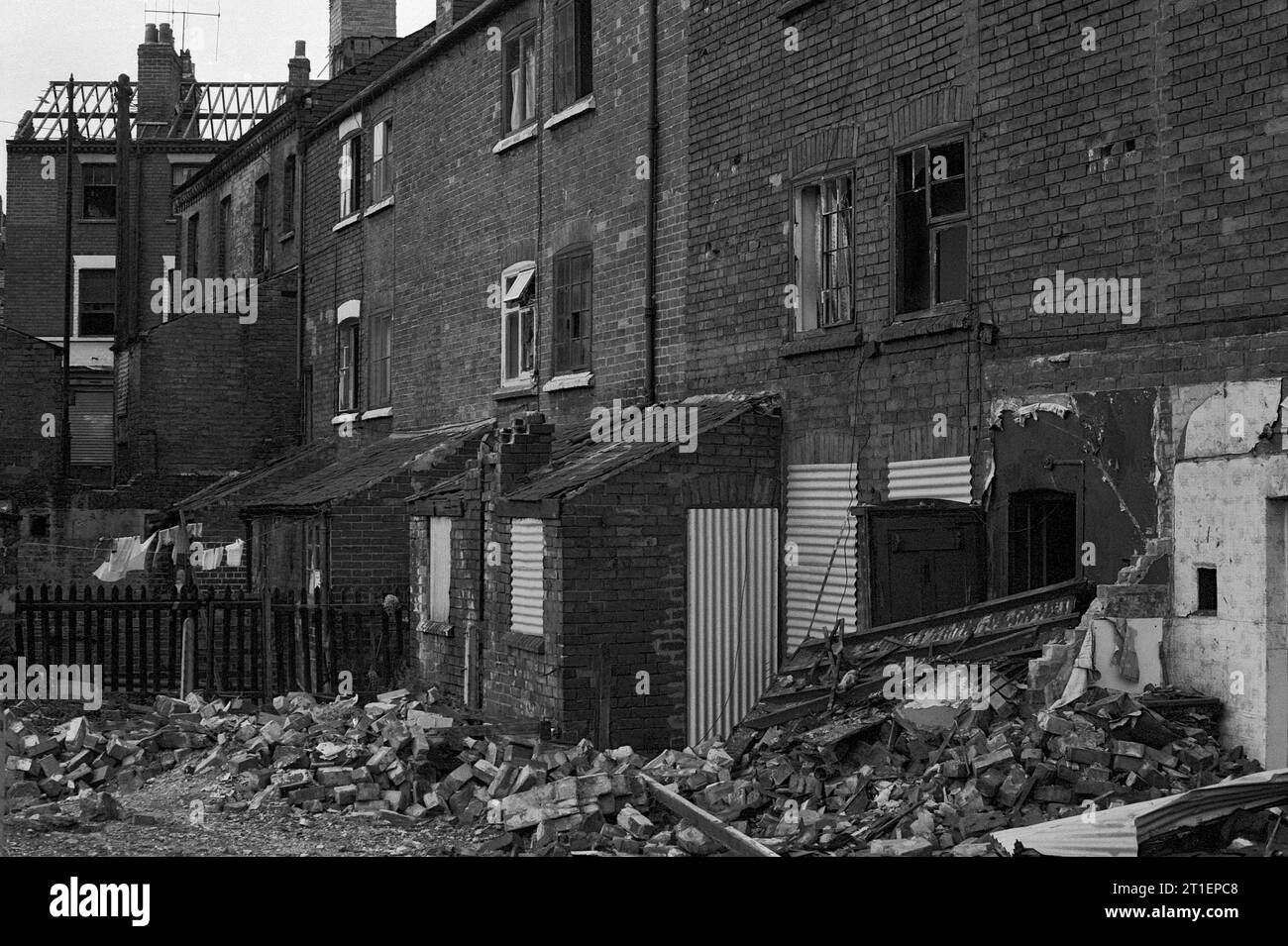 Row of partly demolished three storey Victorian terraced houses, taken