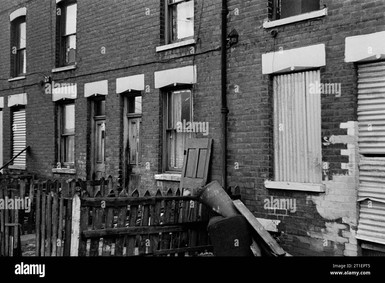 Victorian terraced houses still being lived in, amongst a row awaiting demolition, during the slum clearance of  St Ann's, Nottingham. 1969-1972 Stock Photo