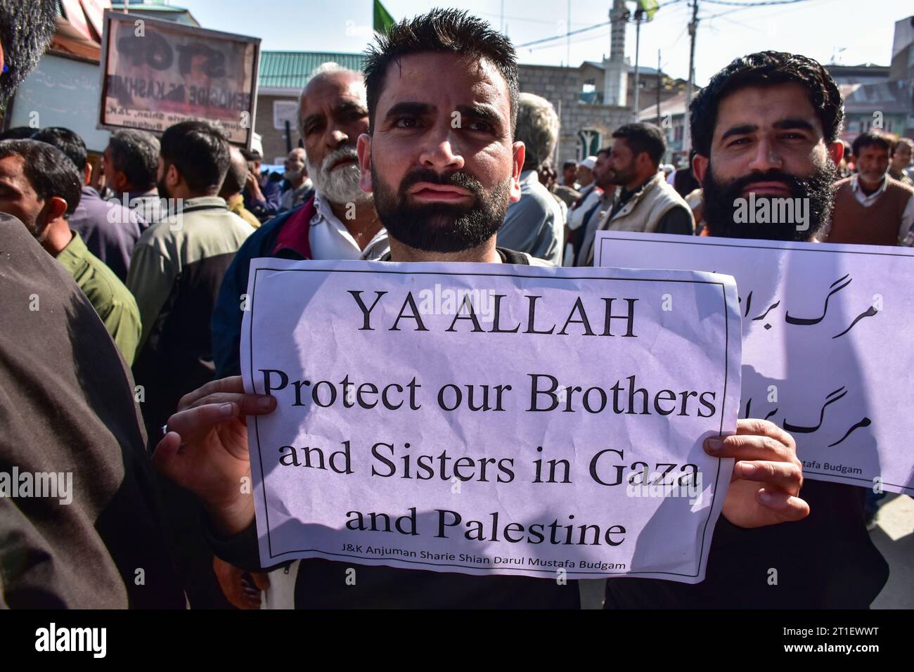 Budgam, India. 13th Oct, 2023. A Kashmiri Muslim holds a placard during ...