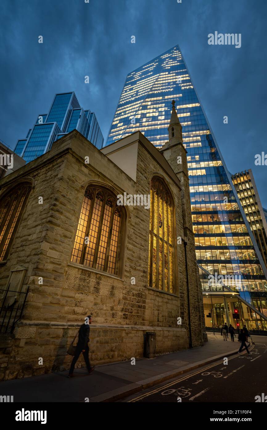 London, UK: St Andrew Undershaft Church on St Mary Axe in the City of London. The Scalpel building at 52 Lime Street is behind. Stock Photo