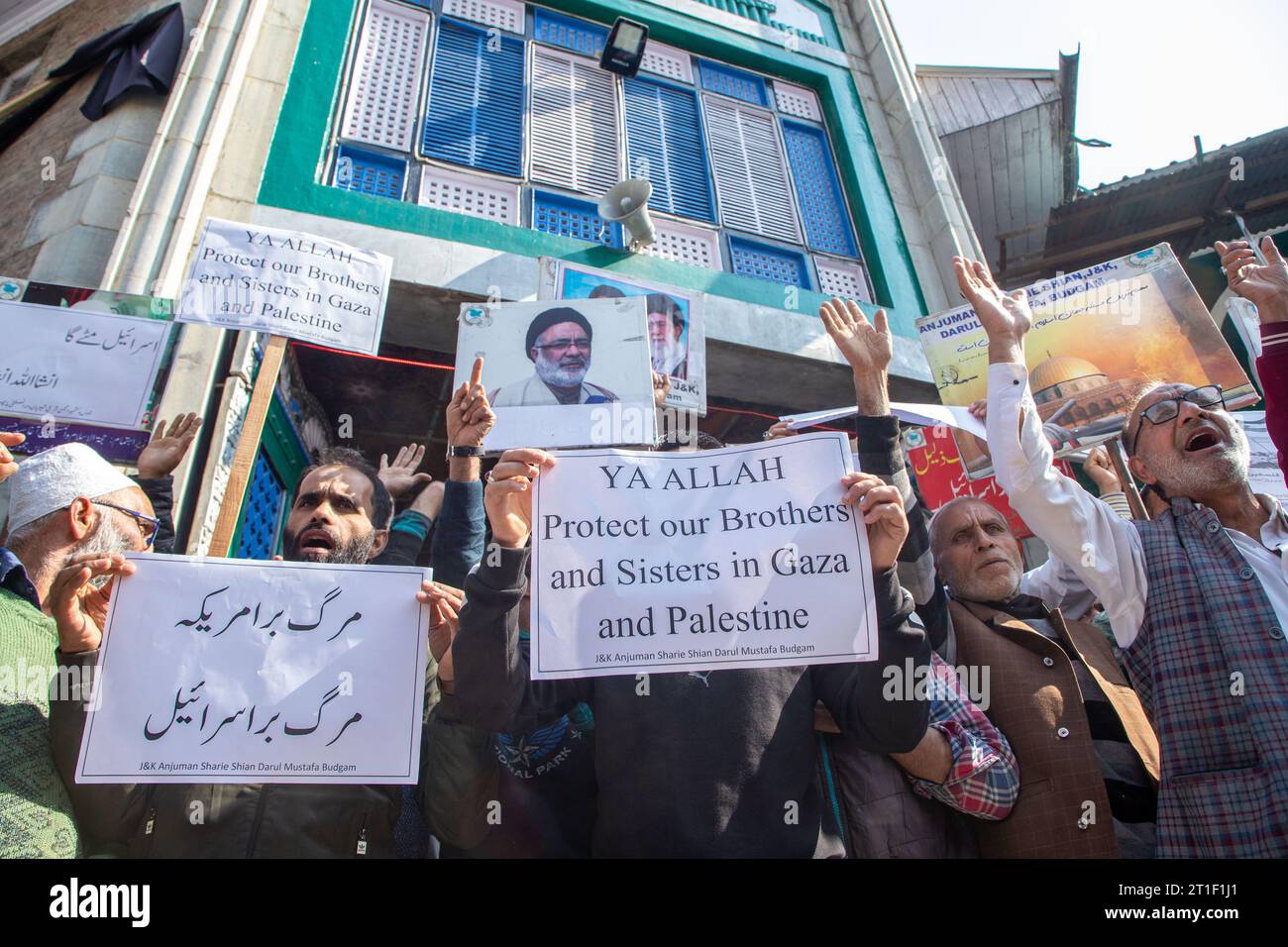 Kashmiri Muslims hold placards while chanting slogans during a ...