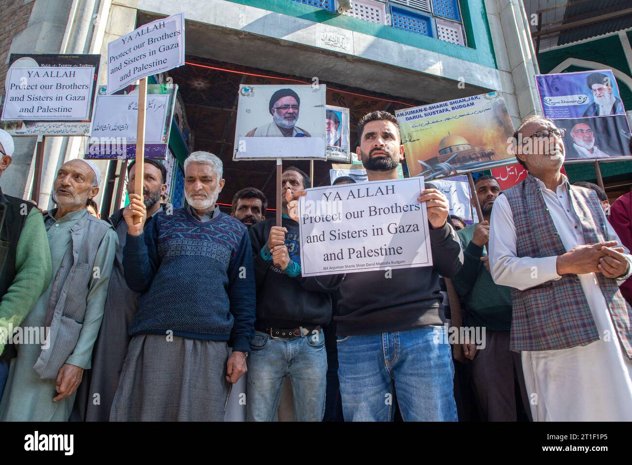 Kashmiri Muslims hold placards during a demonstration in solidarity ...