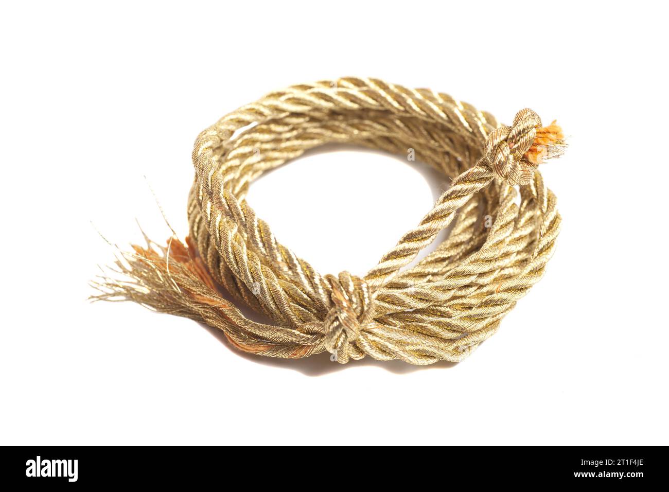 Golden rope isolated on a white background Stock Photo