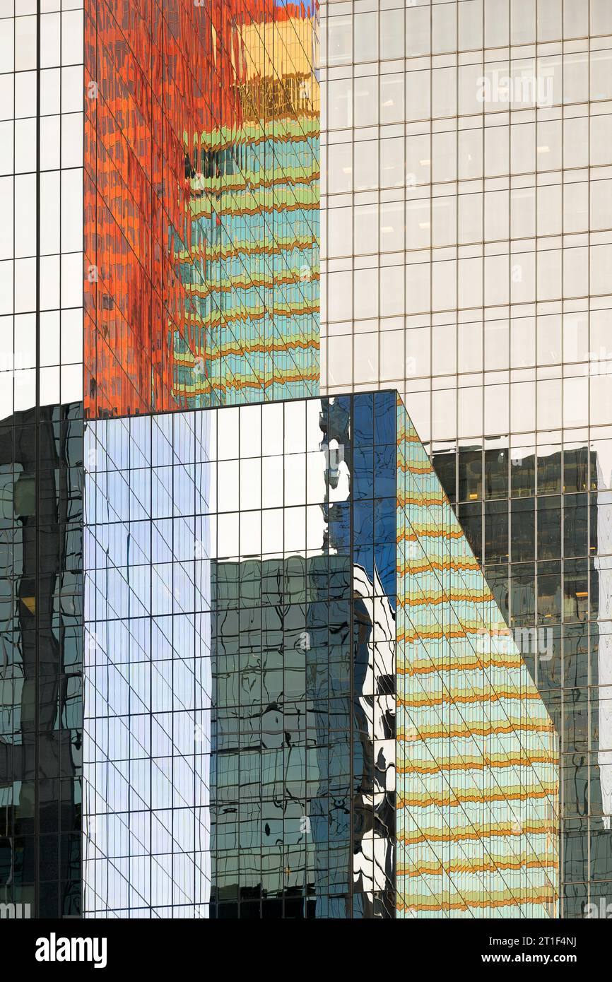 Architectural abstract of colorful reflections off glass walls of modern skyscrapers on Adelaide Street in downtown Toronto, Ontario Stock Photo