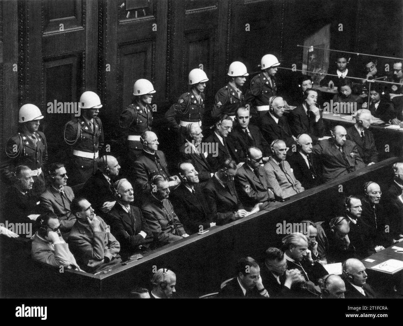 The Second World War 1939 - 1945- Victory and Aftermath Defendants in the dock during the Nuremberg war crimes trials. Left to right: Goering, Hess, Ribbentrop, Keitel, Kaltenbrunner, Rosenberg, Frank, Frick, Streicher, Funk, Schacht, Doenitz, Raeder, Schirach, Sauckel, Jodl, von Papen, von Seyss-Inquart, Speer, von Neurath and H Fritzsche. The trials ended in October 1946 with the execution of 19 of the principal defendants. Similar trials were conducted in Tokyo with respect to the Japanese. Stock Photo