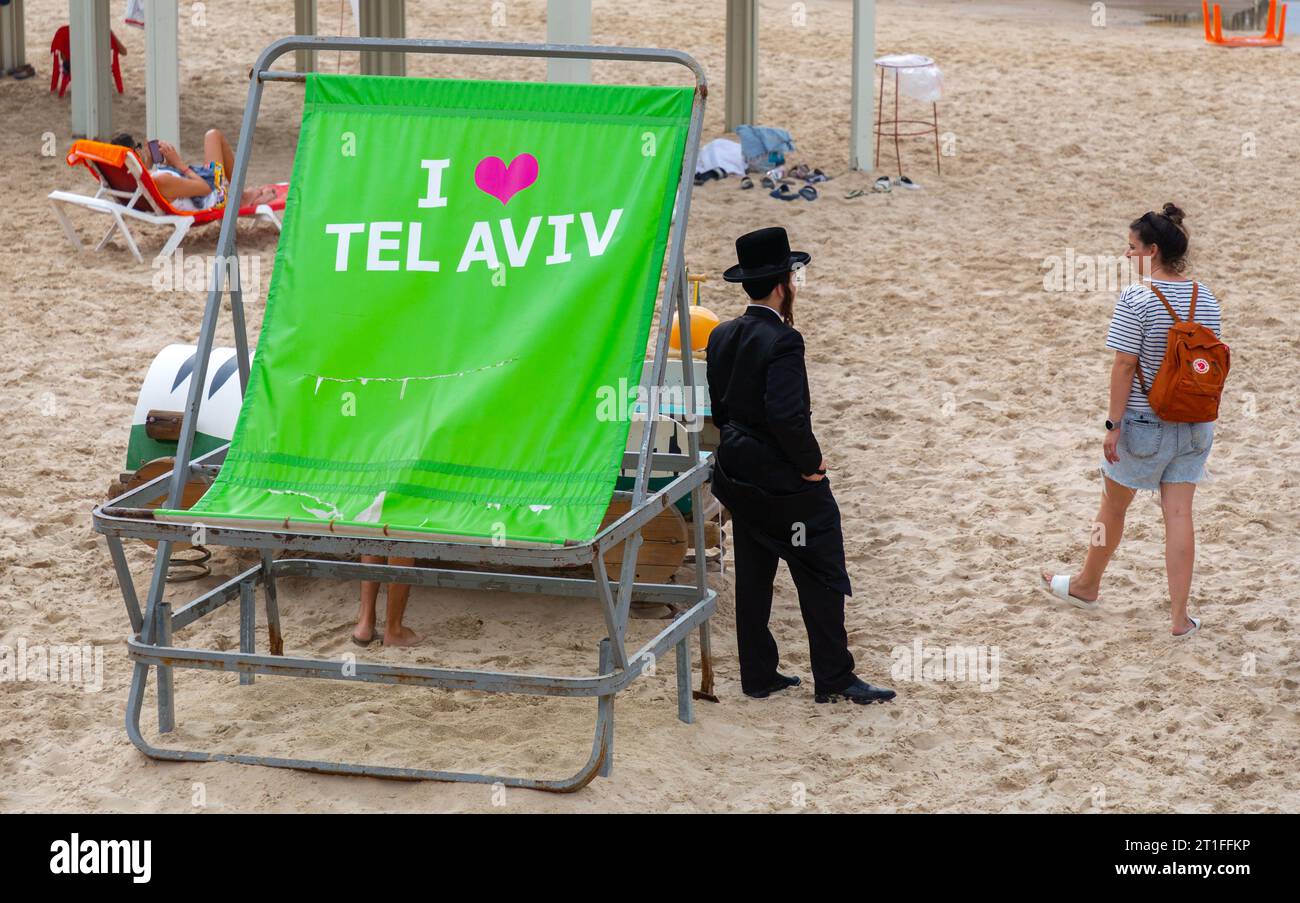 Tel Aviv, Israel - October 2, 2023 - Unidentified ultraorthodox Jewish man on the beach of Tel Aviv. Stock Photo