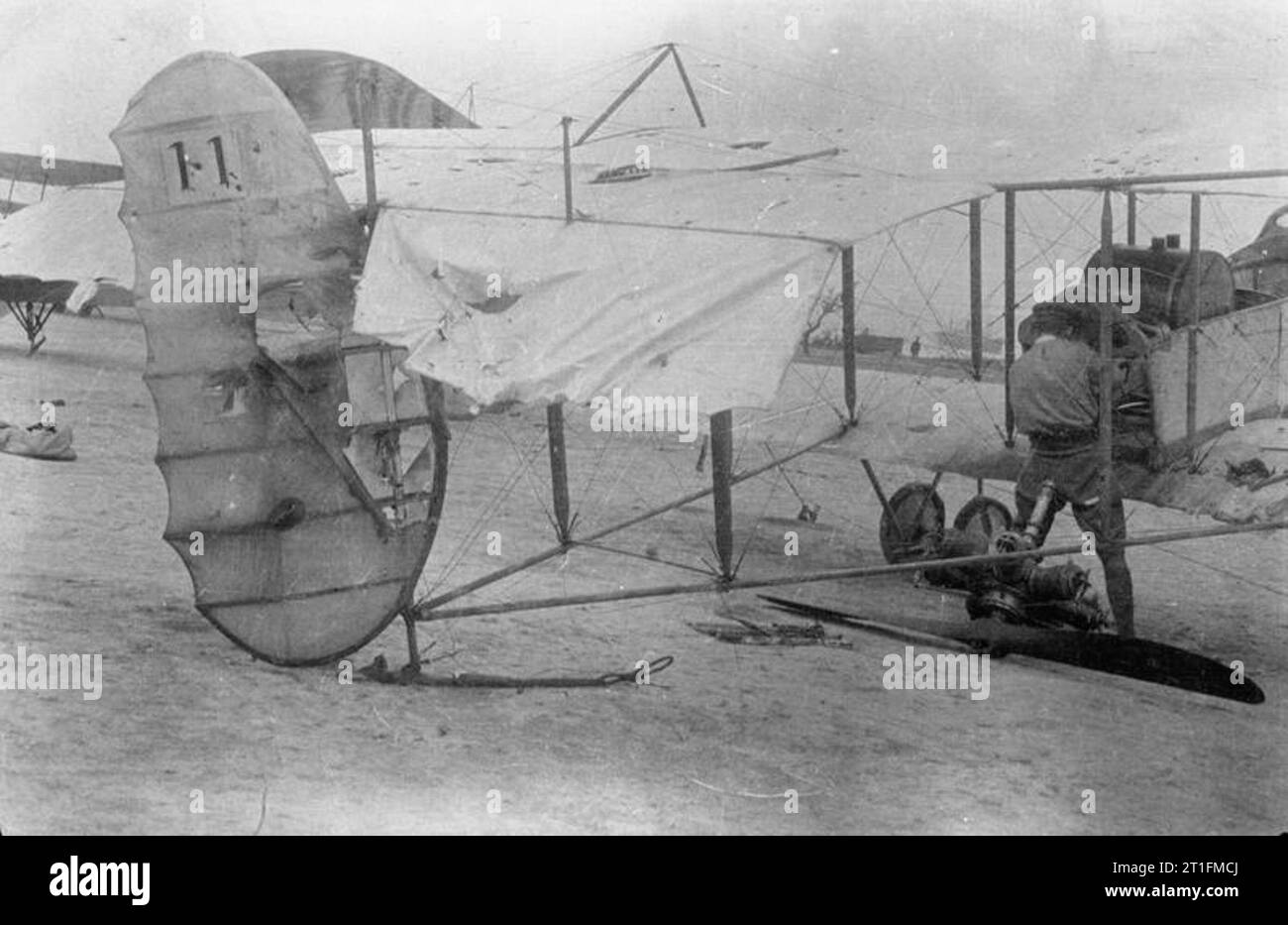 Knatchbull M (capt the Hon) Collection No. 3 Squadron R. N. A. S. Henri Farman aeroplane which had been hit in the air by Turkish gun fire but landed safely. Pilot: Fleet-Commander R. Marix, D. S. O. Observer: Lieutenant the Hon M. Knatchbull, M. C. Gallipoli, June 1915. Stock Photo