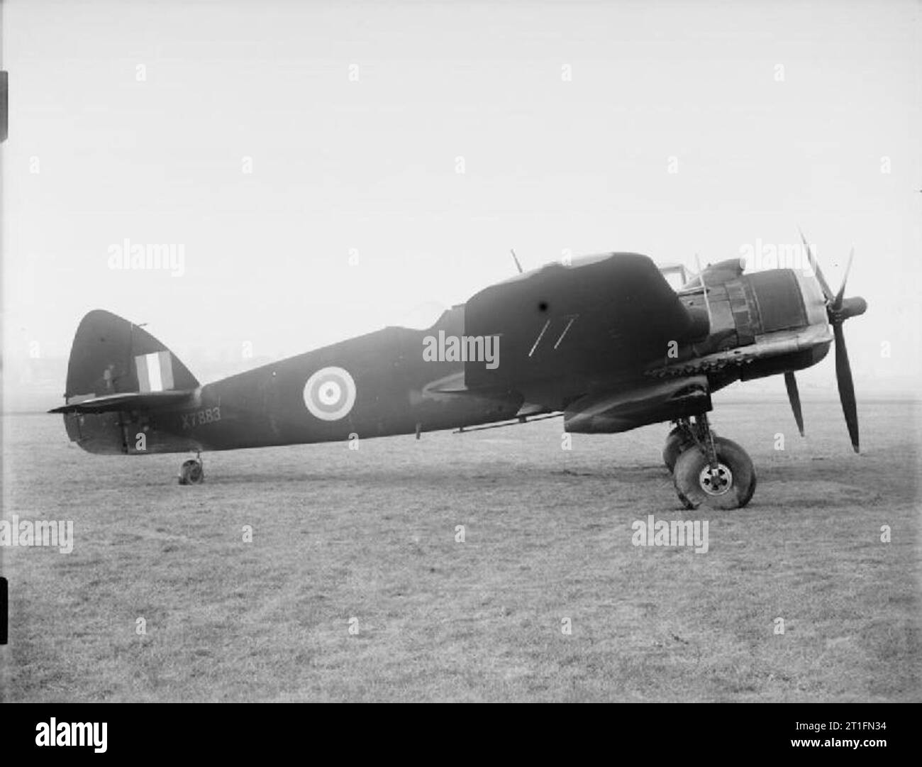 Aircraft of the Royal Air Force, 1939-1945- Bristol Type 156 Beaufighter. Beaufighter Mark VIF, X7883, on the ground at Filton, Bristol, following assembly at the Bristol Aeroplane Company's 'shadow' factory at Old Mixon aerodrome, near Weston-super-Mare, Somerset. X7883 has been painted in overall matt-black RDM2 night-fighter finish and is fitted with AI Mark IV aircraft interception radar. It was tested by the Aeroplane an Armament Experimental Establishment at Boscombe Down, Wiltshire, and then transferred to the USAAF in the Middle East. Stock Photo