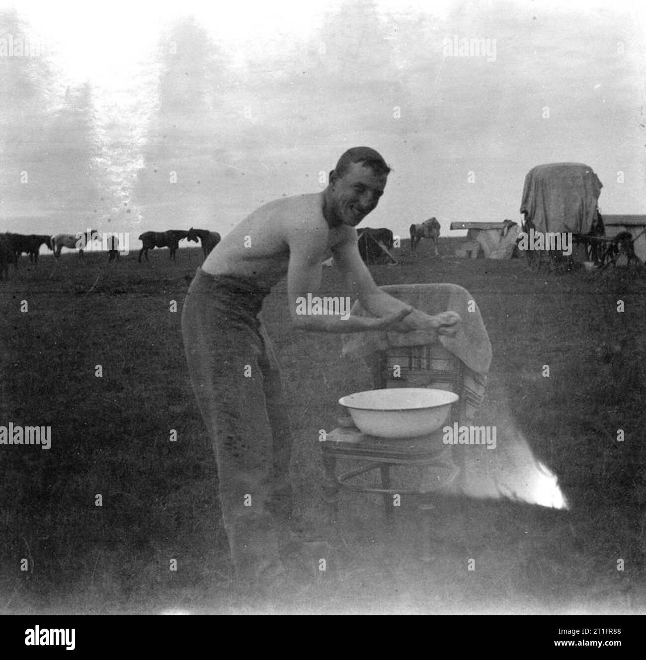 The Second Boer War, 1899-1902 Soldier of one of the British mounted regiments having a wash in the camp. He is probably a serviceman of the Lothians and Berwickshire Yeomanry. Stock Photo