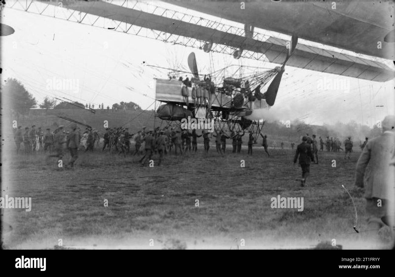 Aviation in Britain Before the First World War The car of the Lebaudy Airship with a large group of army handlers assisting with its landing. Stock Photo