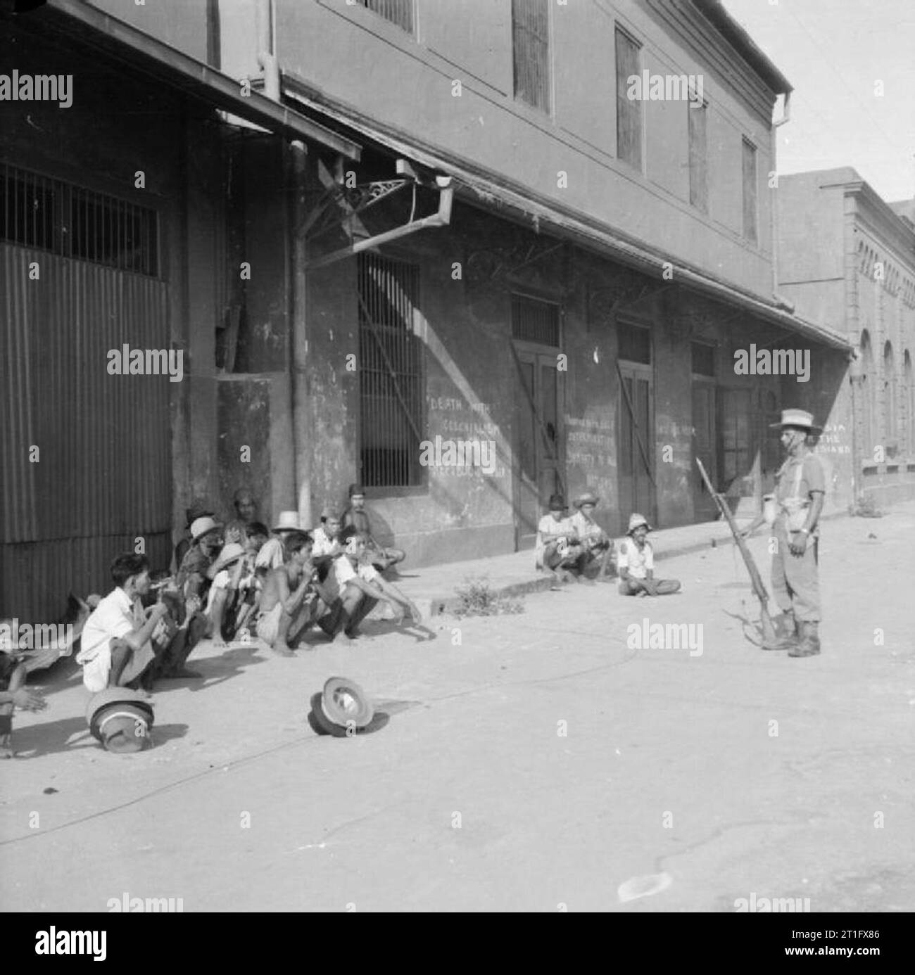 Java Invasion Newspaper The British Occupation of Java Indonesian civilians caught looting ...