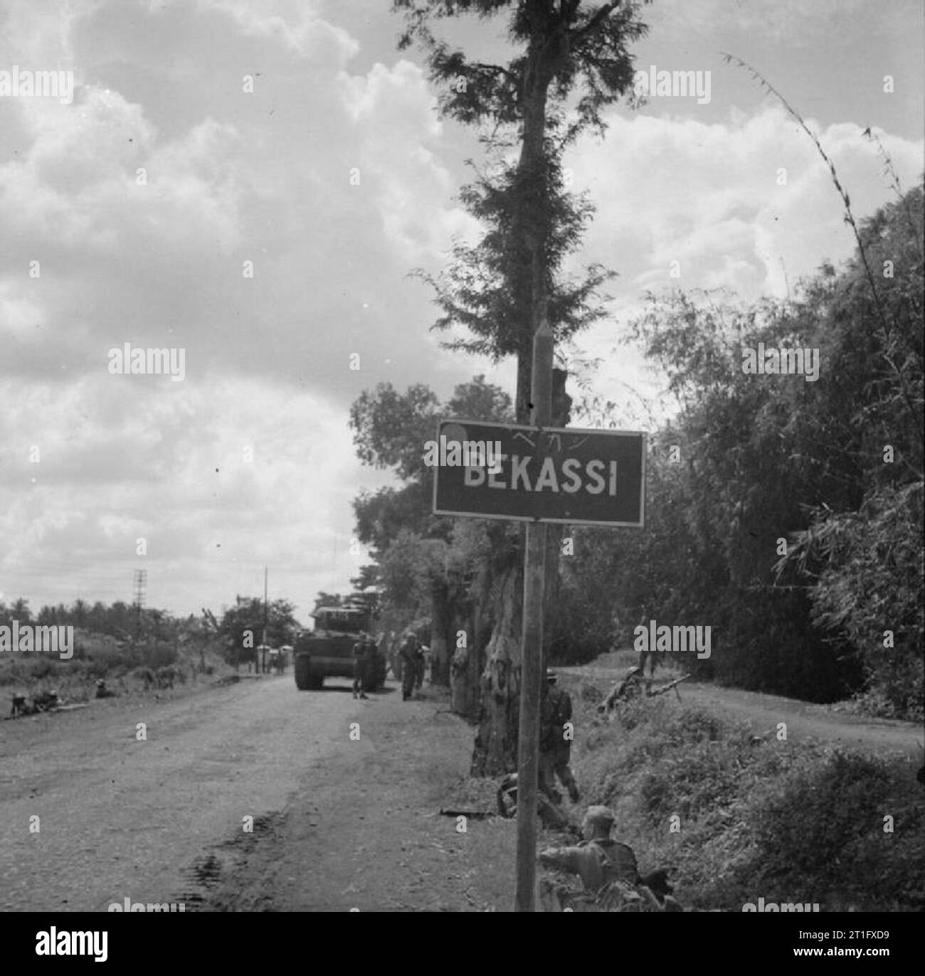 The British Occupation of Java Men of the 4/7th Rajputs and a Sherman tank of the 13th Lancers on the outskirts of Bekassi during a reconnaissance in force to locate positions held by Indonesian nationalists. Stock Photo