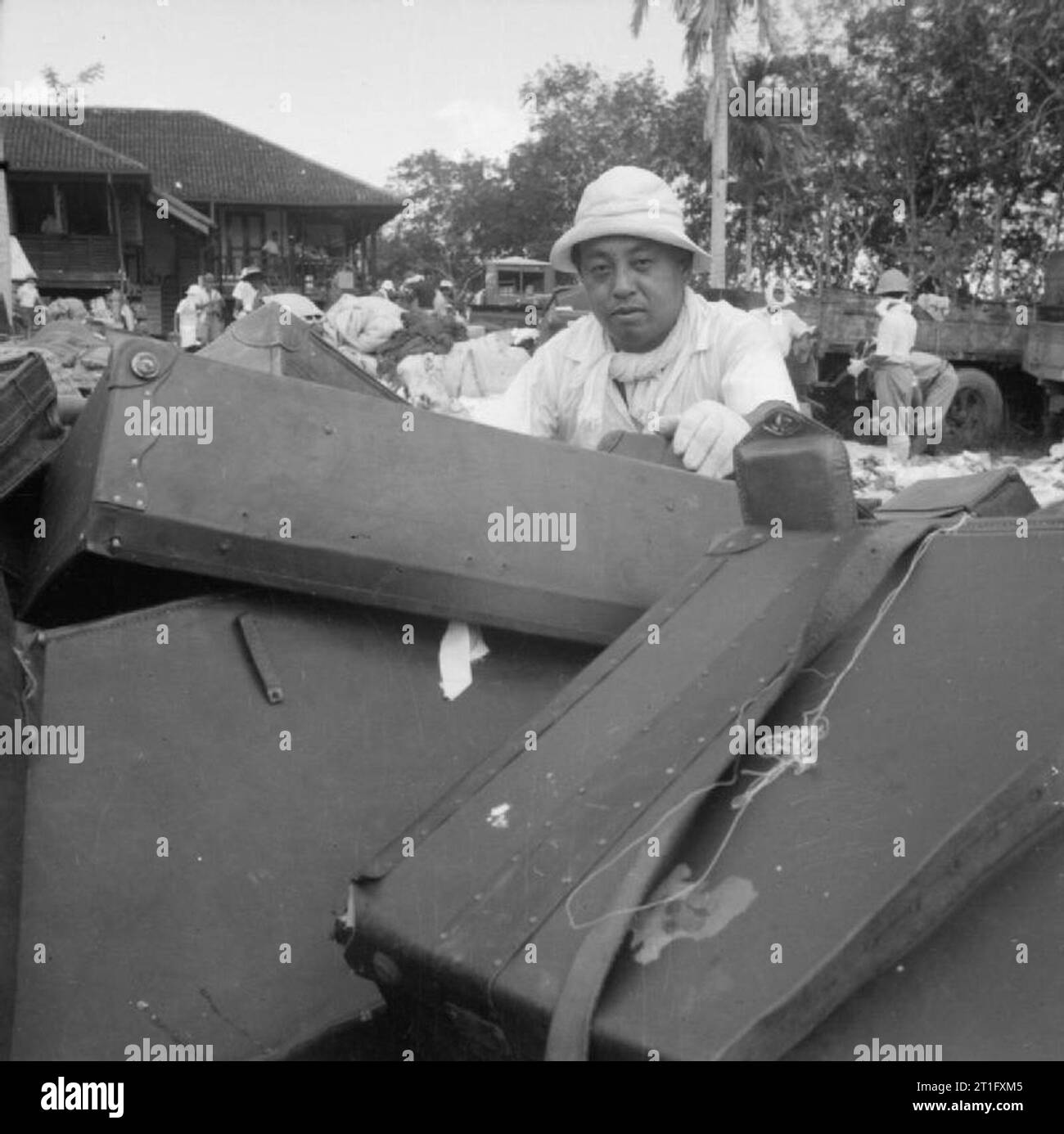 The British Reoccupation of Singapore A Japanese civilian piling up ...