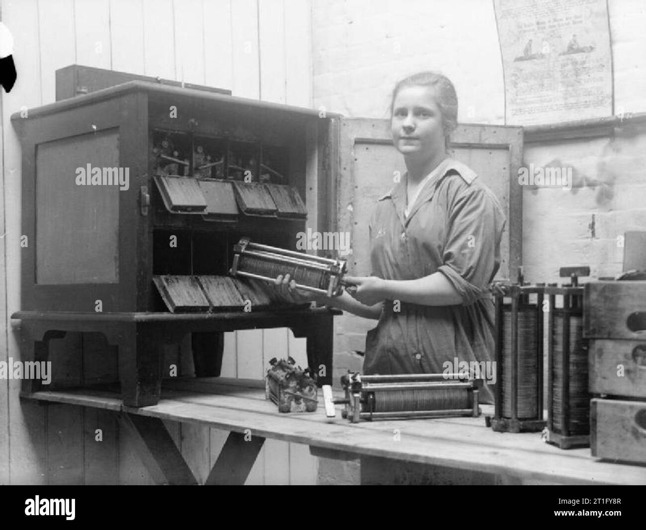 Industry during the First World War A female worker places pieces of