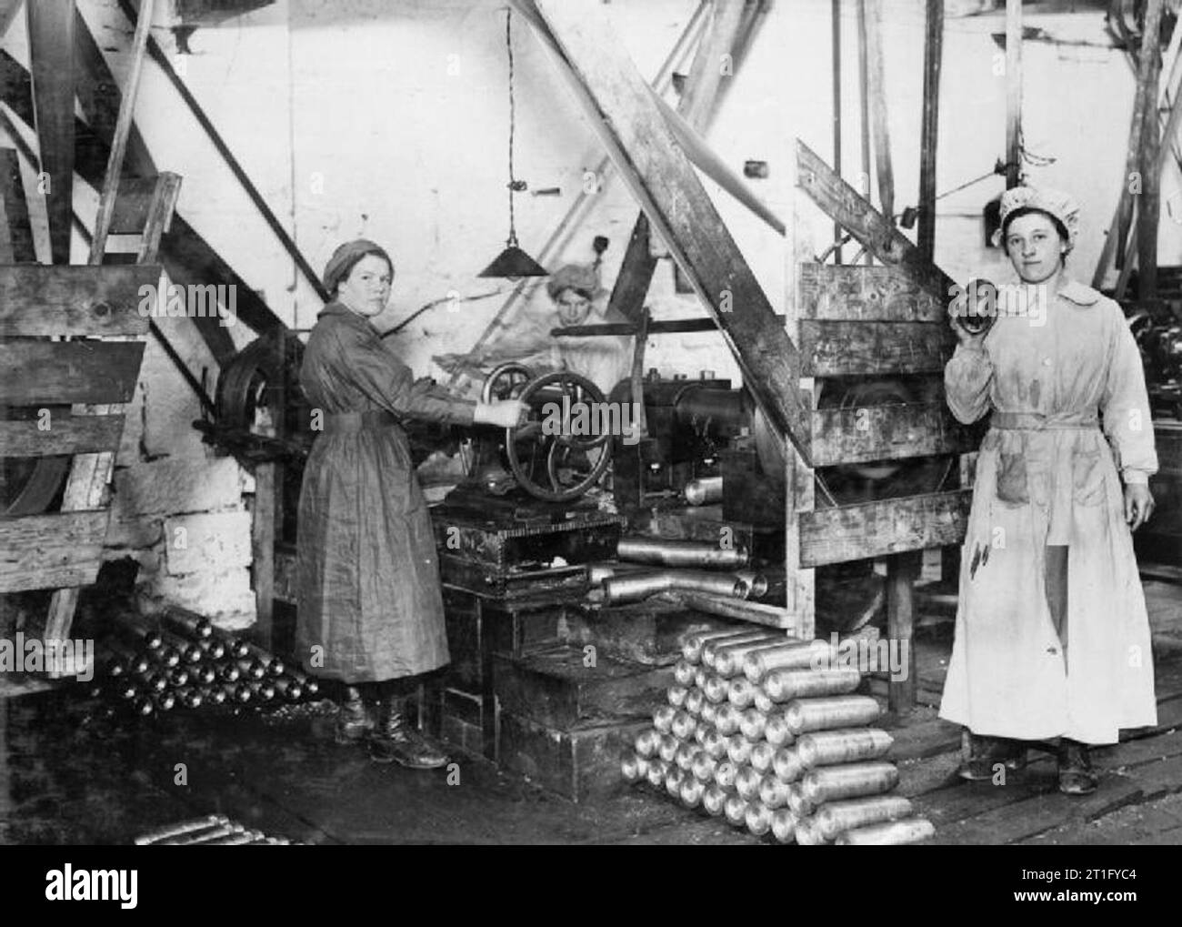 Industry during the First World War Female munitions workers operating lathes in a British shell factory during the First World War. Stock Photo