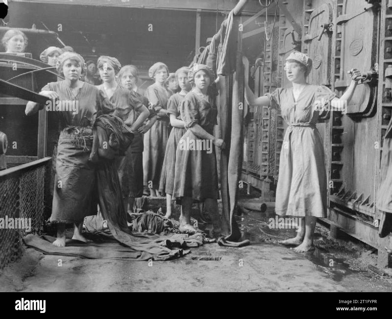 Women at work during the First World War Women war workers prepare filter cloths for the filter presses at a sugar refinery in Scotland. Stock Photo