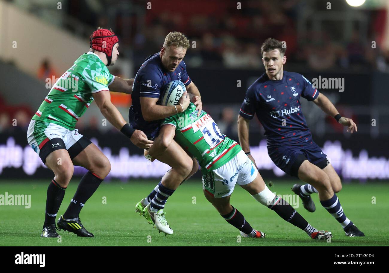 Bristol Bears' James Williams is tackled by Leicester Tigers' Olly Cracknell (left) and Charlie Atkinson during the Gallagher Premiership match at Ashton Gate, Bristol. Picture date: Friday October 13, 2023. Stock Photo