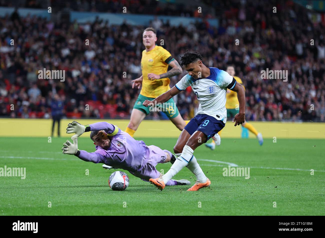 London, UK. 13th Oct, 2023. Mathew Ryan of Australia dives in front of Ollie Watkins of England during the International Friendly match at Wembley Stadium, London. Picture credit should read: David Klein/Sportimage Credit: Sportimage Ltd/Alamy Live News Stock Photo