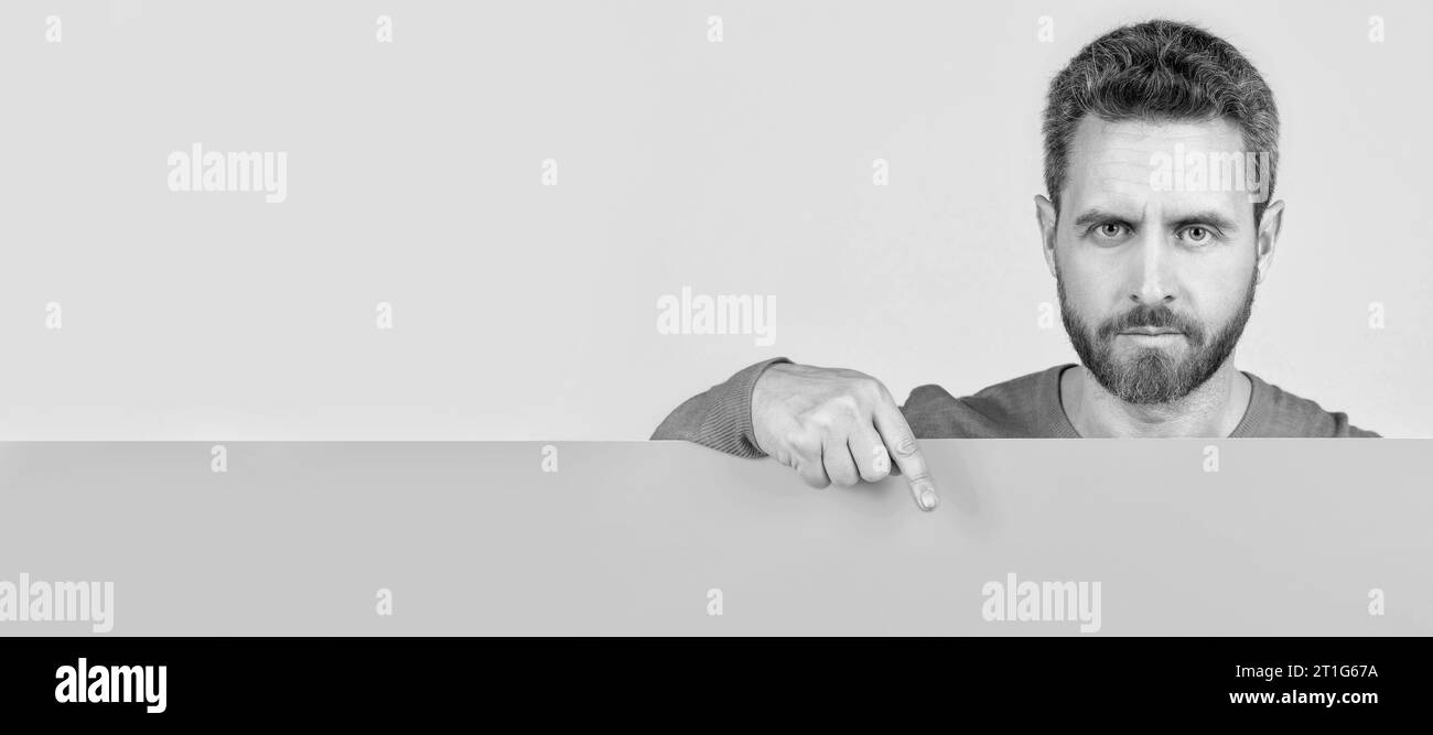 Man face portrait, banner with copy space. for your marketing design. bearded man with paper