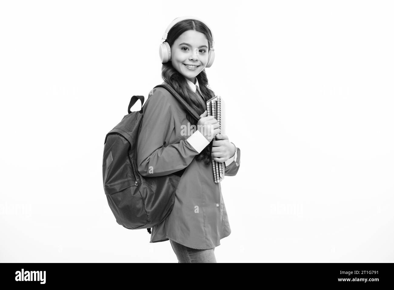Back to school. Schoolgirl student in headphones with school bag ...