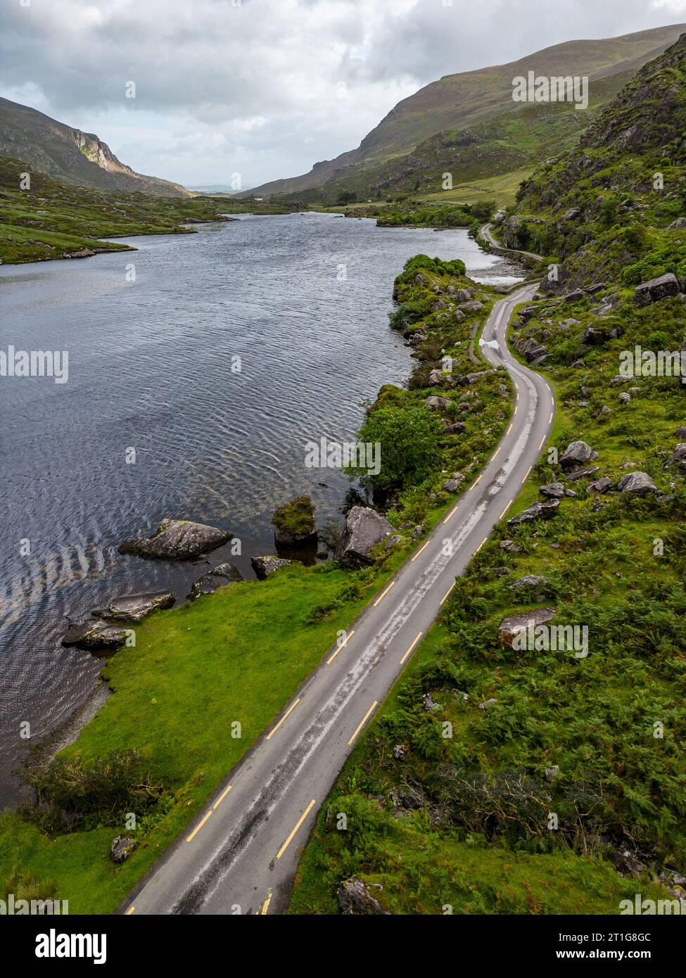 Aerial view of road and lake at Gap of Dunloe with rocks and vegetation