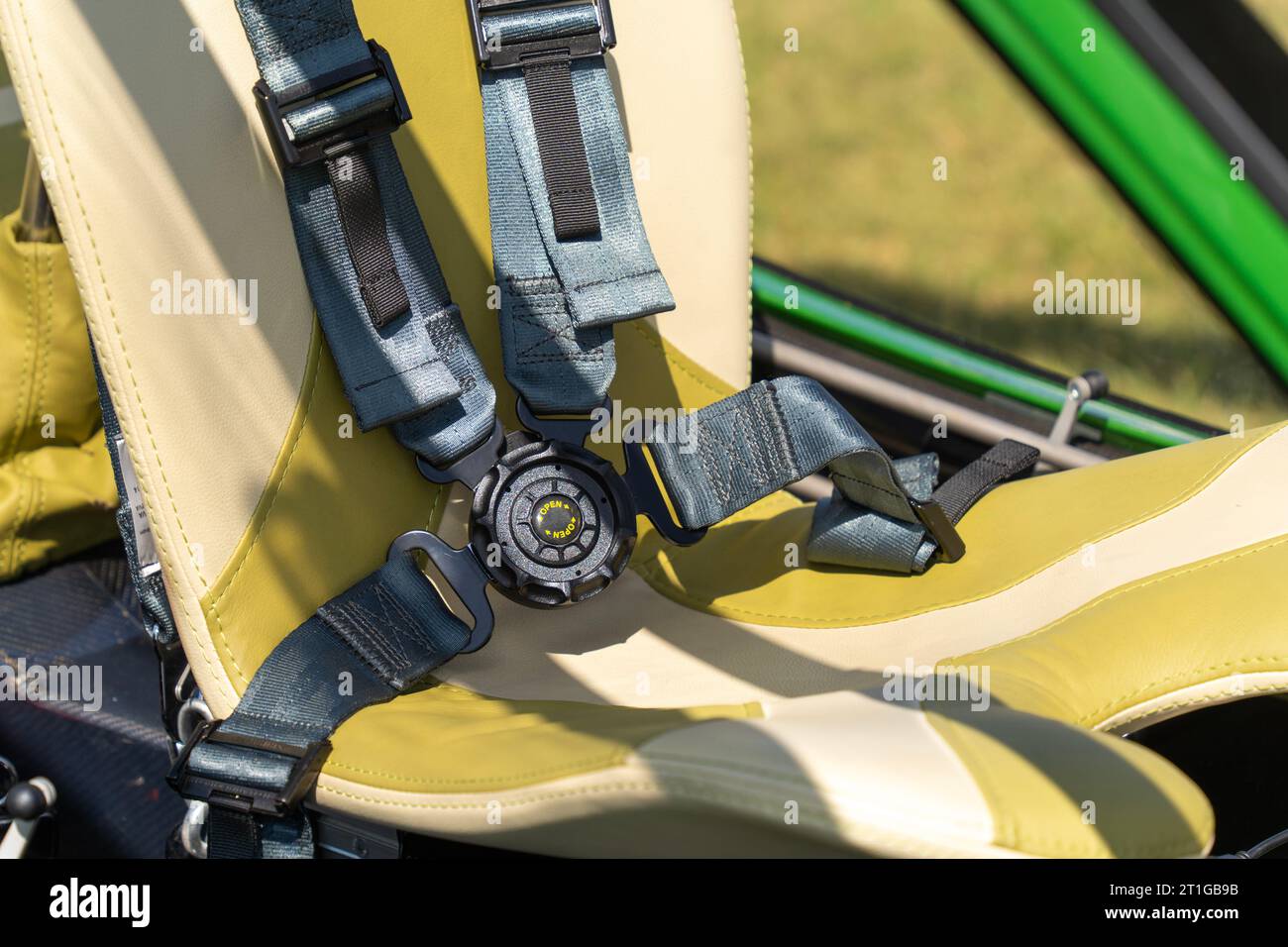 Airplane pilot's seat with 4point safety belt Stock Photo Alamy