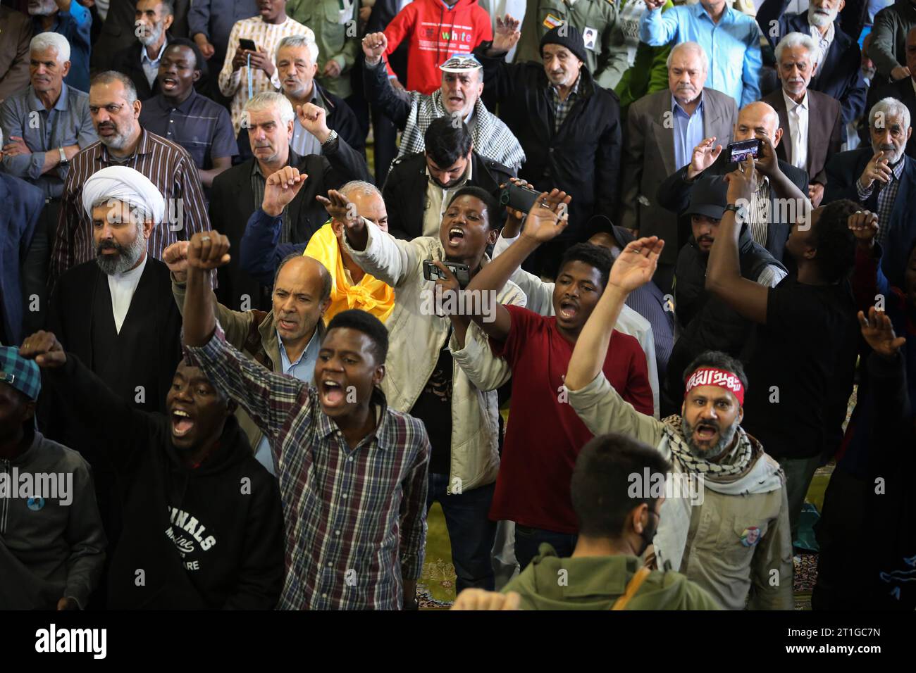 Tehran, Iran. 13th Oct, 2023. Worshippers chant slogans at the University of Tehran during a Friday prayer ceremony after an anti-Israel rally to show solidarity with the Palestinian people. Thousands of Iranians took to the streets of Tehran in a show of support for Palestinians amid a bloody conflict between Israel and Hamas. Thousands of Israelis and Palestinians have died after the militant group Hamas launched an unprecedented attack on Israel from the Gaza Strip on 07 October 2023. (Credit Image: © Rouzbeh Fouladi/ZUMA Press Wire) EDITORIAL USAGE ONLY! Not for Commercial USAGE! Stock Photo