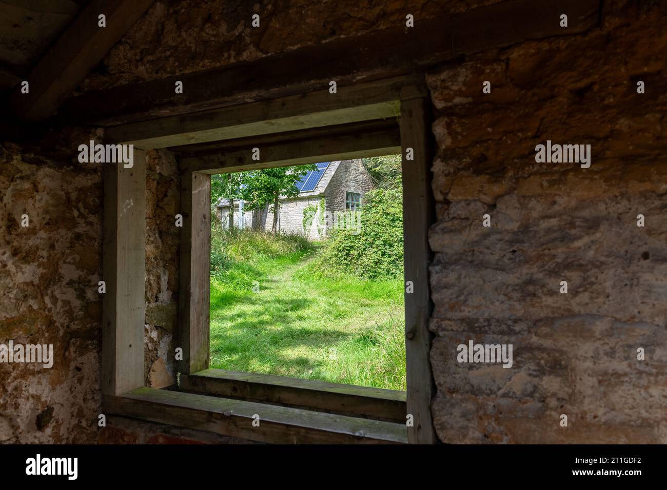 View through a window of the old school house in Tyneham village in Dorset Stock Photo
