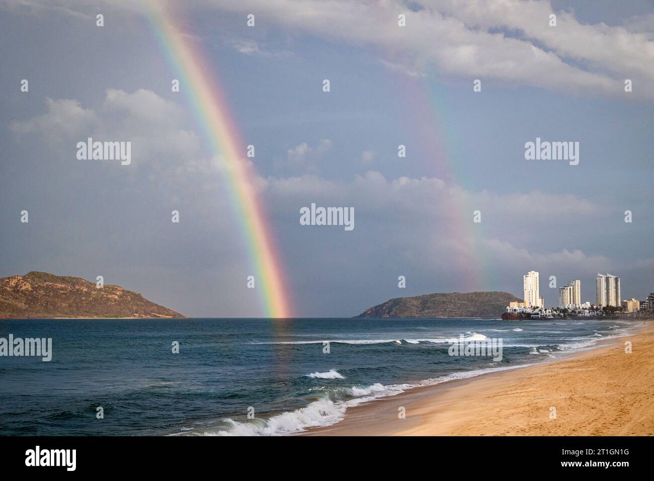 A double rainbow over the Pacific Ocean in Mazatlan, Sinaloa, Mexico. Stock Photo