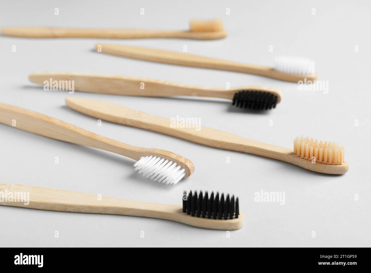 Many different bamboo toothbrushes on white background Stock Photo - Alamy