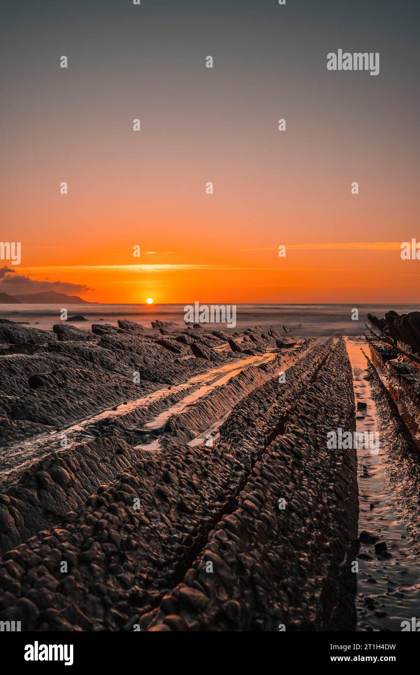 The incredible Flysch, a beautiful sunset in Sakoneta, is a beach in Deba. It is the western end of the Geopark of the Basque Coast, Guipuzkoa Stock Photo