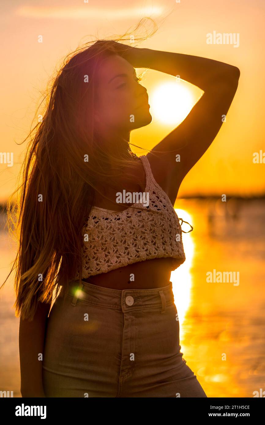 One young woman beach thinking wool hi-res stock photography and images ...