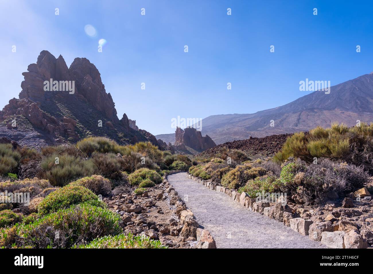 Beautiful path between the Roques de Gracia and the Roque Cinchado in the natural area of Teide in Tenerife, Canary Islands Stock Photo